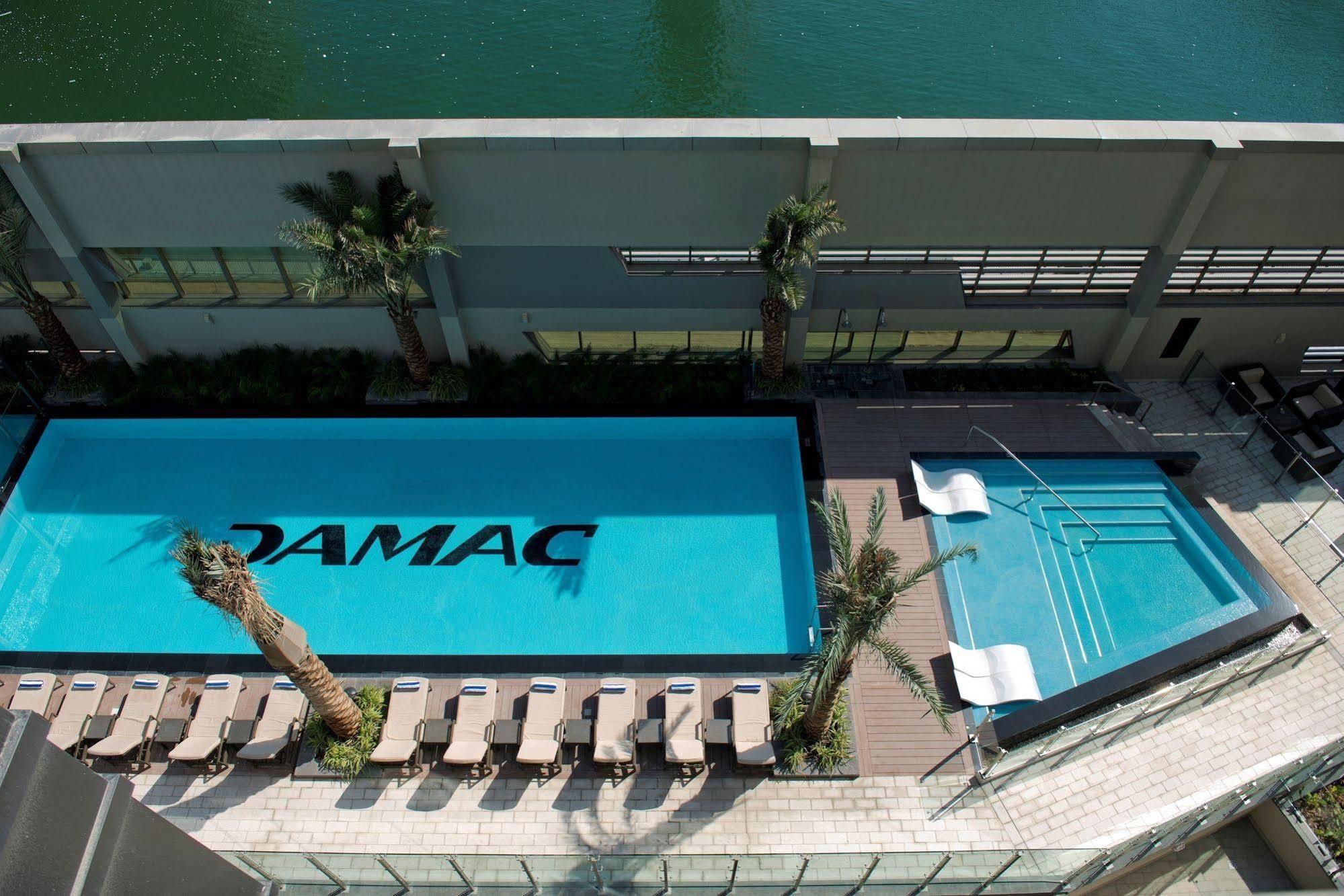 Damac Maison The Vogue Dubai Eksteriør bilde The pool at the TAMAC headquarters